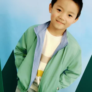 Giacca a vento reversibile bambino Mayoral verde e azzurra rigata